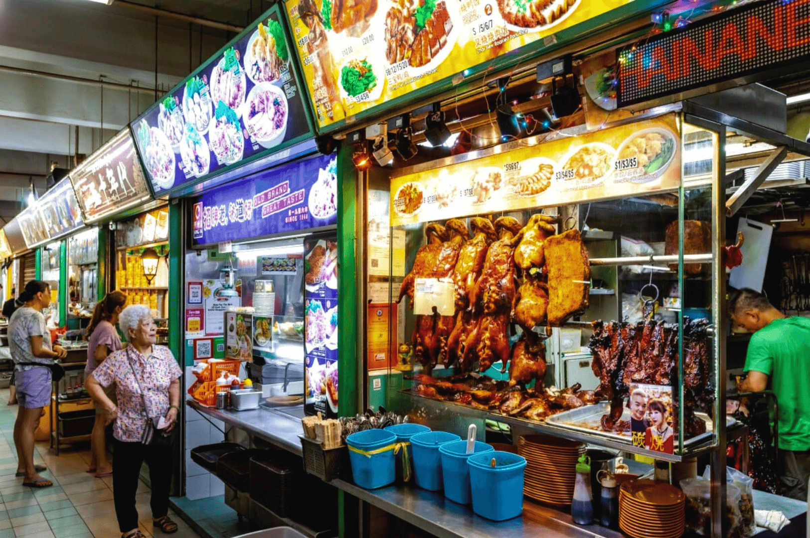 Inside a bustling hawker centre in Singapore’s central business district, food stalls and hawker stalls serve delicious food like hainanese chicken rice, char kway teow, nasi lemak, chilli crab, satay, hokkien mee, and other local dishes. This vibrant food centre, part of singapore's hawker centres culture, features street food vendors and open air food courts offering hawker food from iconic spots like Maxwell Food Centre, Lau Pa Sat, Tiong Bahru Market, Satay Street, Airport Road Food Centre, and Little India. Expats enjoying lunch rush near Marina Bay, City Hall, Orchard Road, and Tanjong Pagar reflect expat life and the significant impact of hawker centers on moving abroad, expat packages, school fees, health insurance, employment pass, and property cost. Located near mass rapid transit and the subway system, this central location is a short walk from international schools and hidden gems. Anthony Bourdain once praised singapore's hawker centers as a must visit spot to eat, make new friends, and connect with your home country. With most stalls recently renovated and other stalls offering indian food and Chinatown flavors, this hawker center guide offers advice, tips, and insights into singapore's identity, business, services, and living in Southeast Asia—a world-class destination for food, life, and local culture.
