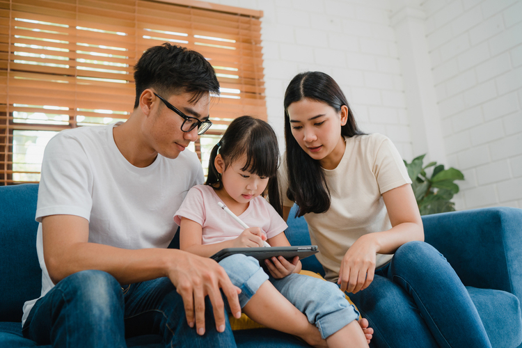 International School Singapore : Family time in the living room symbolising balanced education and home life.