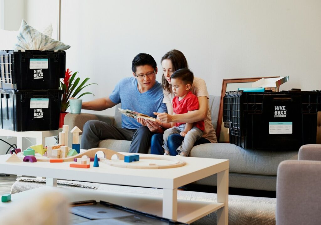 Preparing for Primary School : Parents encouraging their child while practising reading at home.