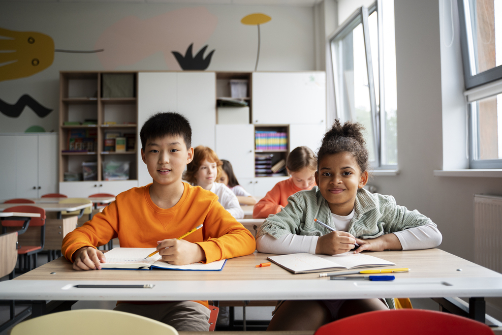 International School Singapore : Students engaging in collaborative learning at a modern international school classroom