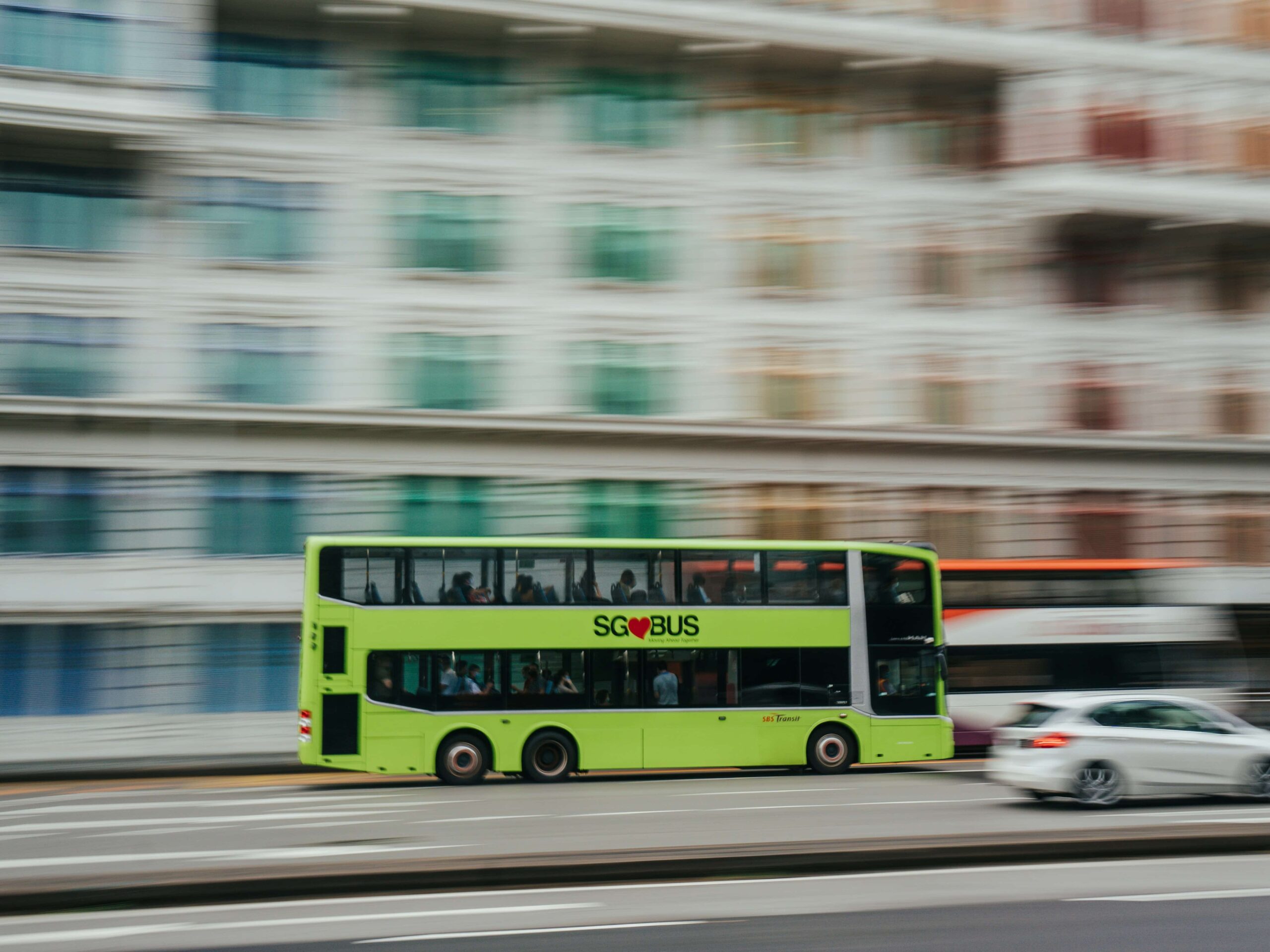 A Singapore transit bus speeding through the highway.