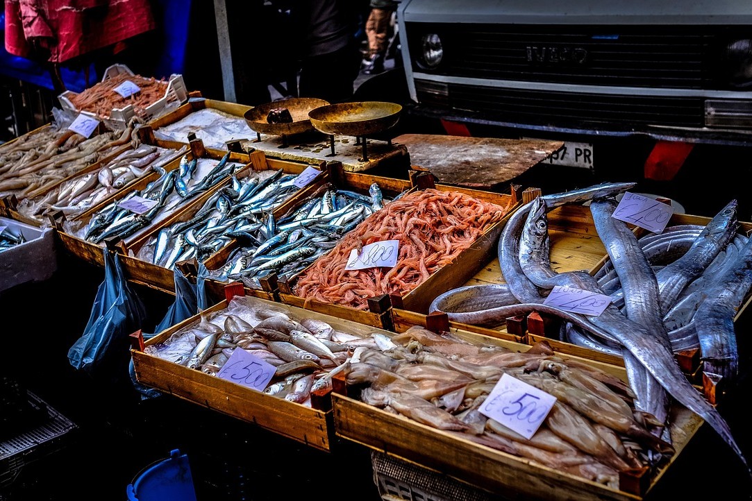 A photo of a multiple stocked baskets of fresh fishes.