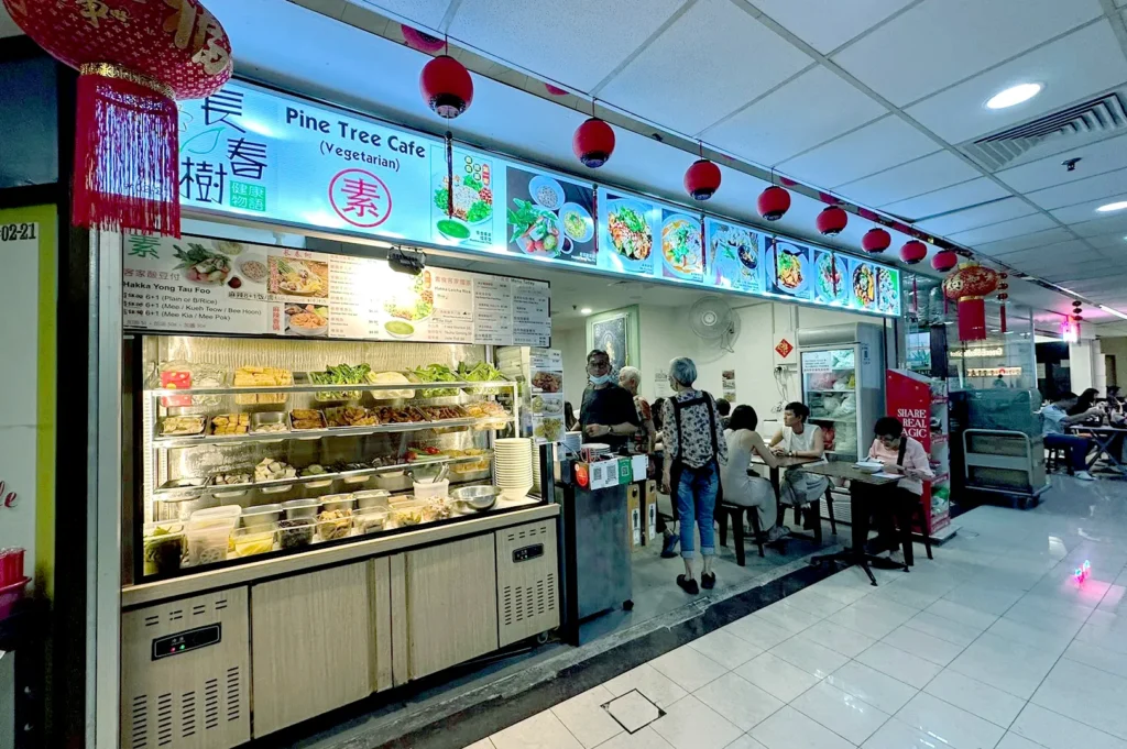 Vegetarian hawker stall with display dishes and menu at Fortune Centre.