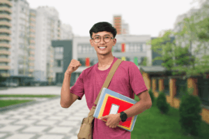 Smiling student in maroon t-shirt stands outside a modern Singaporean campus, holding textbooks and a smartphone—symbolizing the nation’s vibrant tuition culture and the blend of traditional study with digital learning. A tan shoulder bag and smartwatch hint at the fast-paced, tech-integrated lifestyle of students navigating supplementary education.