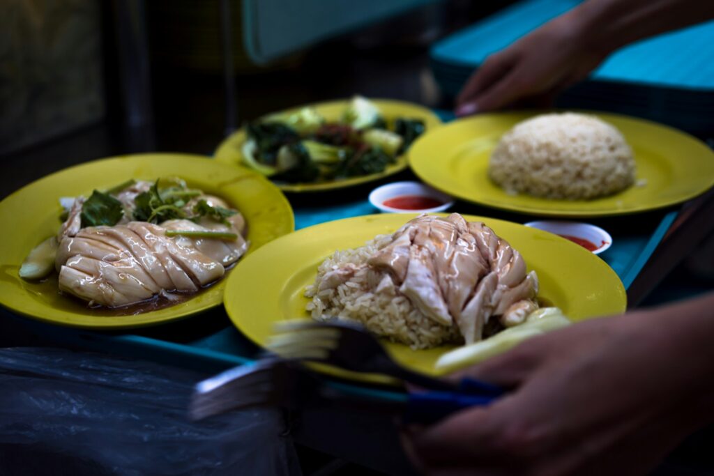 An image of a Hainanese Chicken Rice sitting on a tray ready to be served.