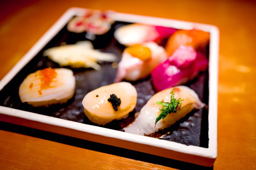 Assorted gourmet sushi platter with fresh seafood and vibrant toppings