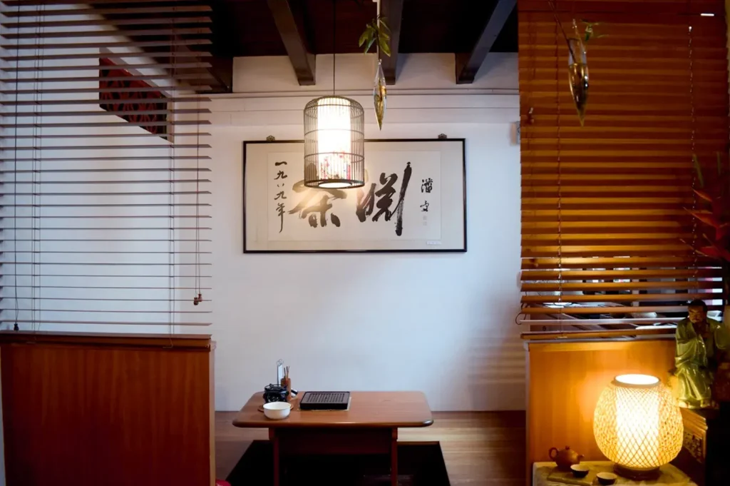 Minimalist Chinese tea room interior with warm lighting and wooden decor