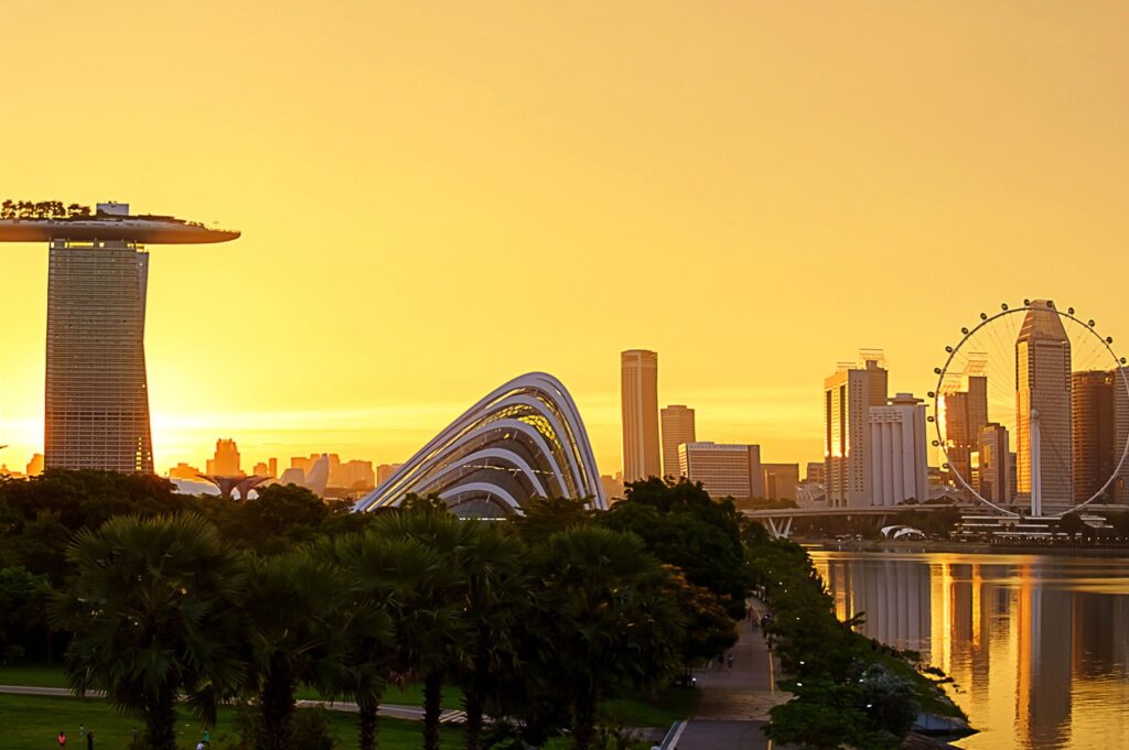 Singapore skyline at sunrise featuring Marina Bay Sands and the Singapore Flyer.