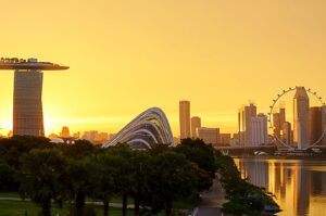 Singapore skyline at sunrise featuring Marina Bay Sands and the Singapore Flyer.