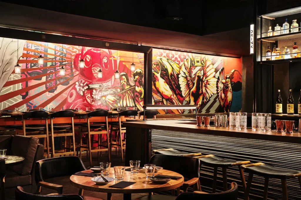 Neon Pigeon modern izakaya interior with colorful graffiti wall and creative Japanese dining atmosphere in Keong Saik Road