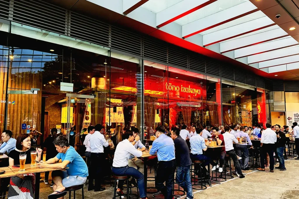 Tono Izakaya Singapore outdoor dining with busy after-work crowd in Marina Bay CBD Singapore nightlife scene