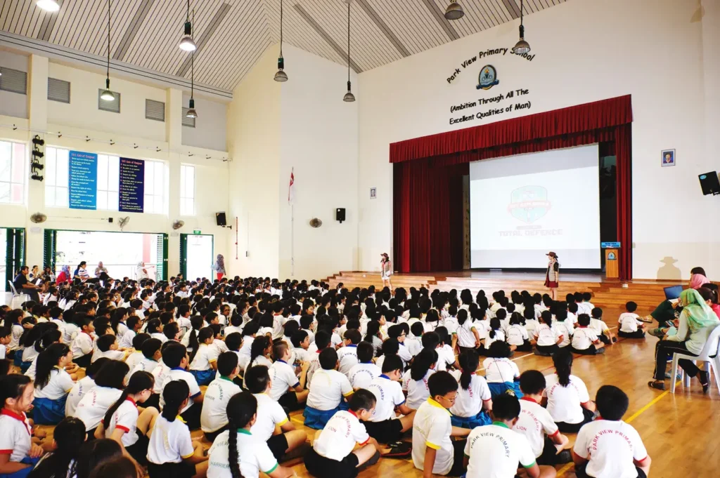 Singapore primary school assembly hall students gathered for school program education system local school experience