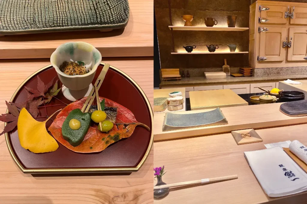 Sashimi plate with autumn leaf garnish at sushi counter.