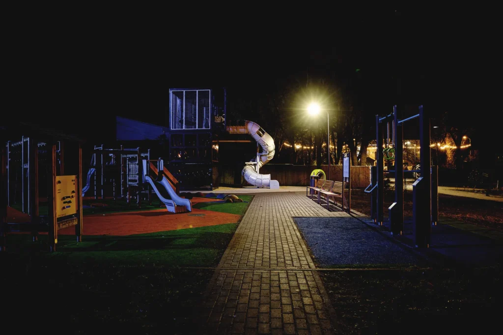 empty playground at night in Singapore neighborhood soft lighting quiet moments reflecting expat life and evening walks