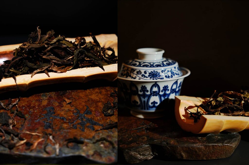Chinese tea ceremony setup with porcelain cups, gaiwan, and tea snacks in a refined Singapore tea tasting experience