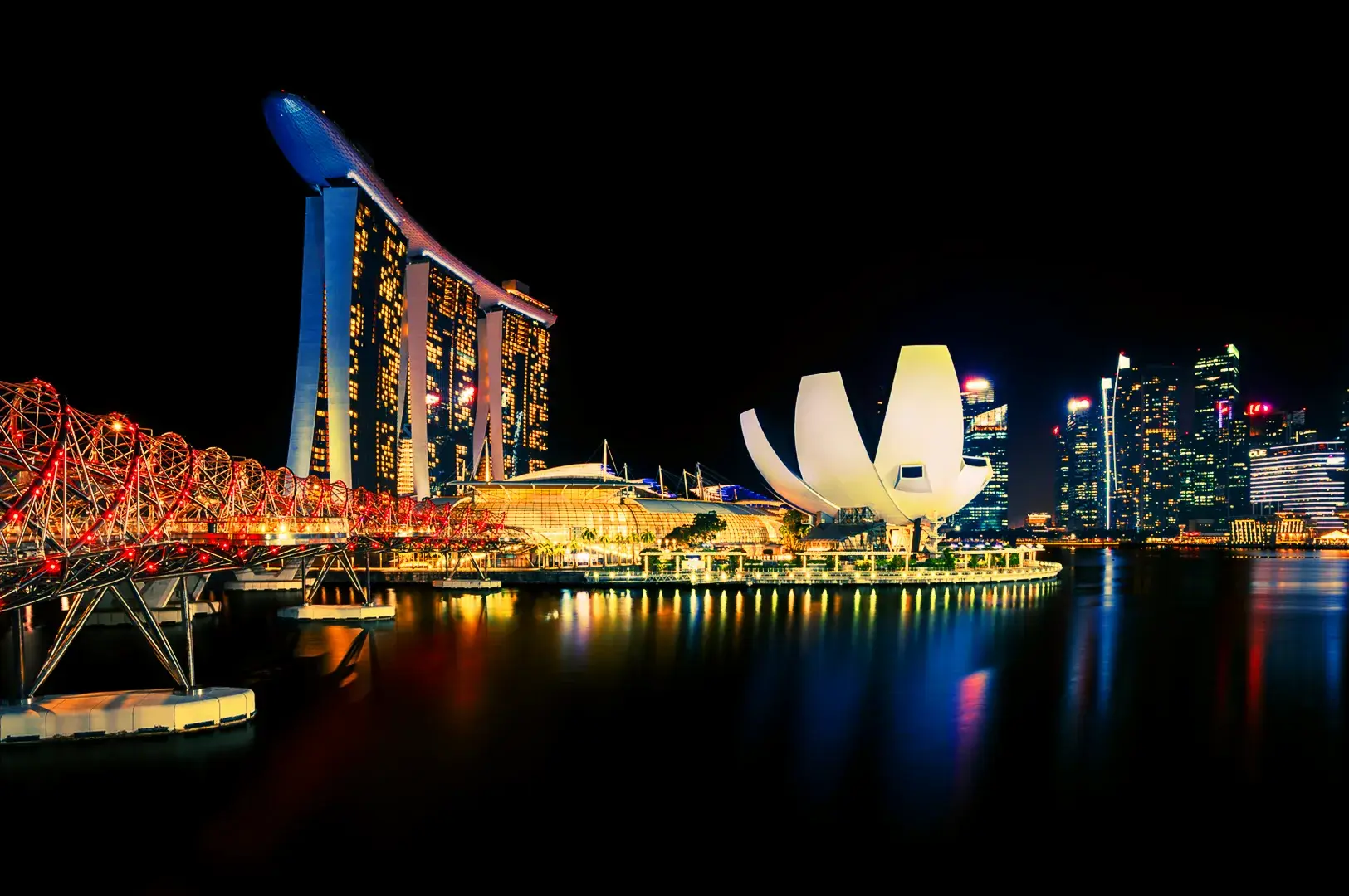 Singapore Marina Bay skyline at night with Marina Bay Sands and ArtScience Museum illuminated