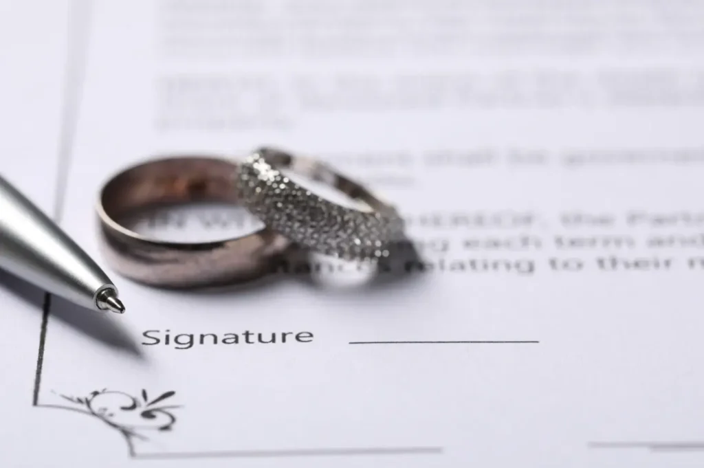 Wedding rings on signed document.