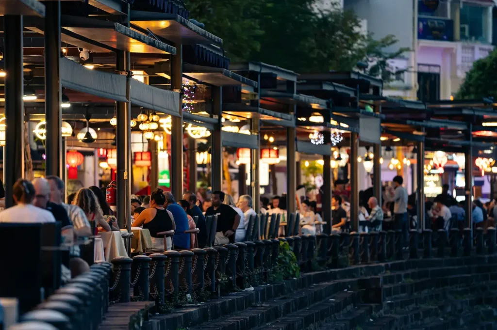 Outdoor dining at Singapore street market, evening.