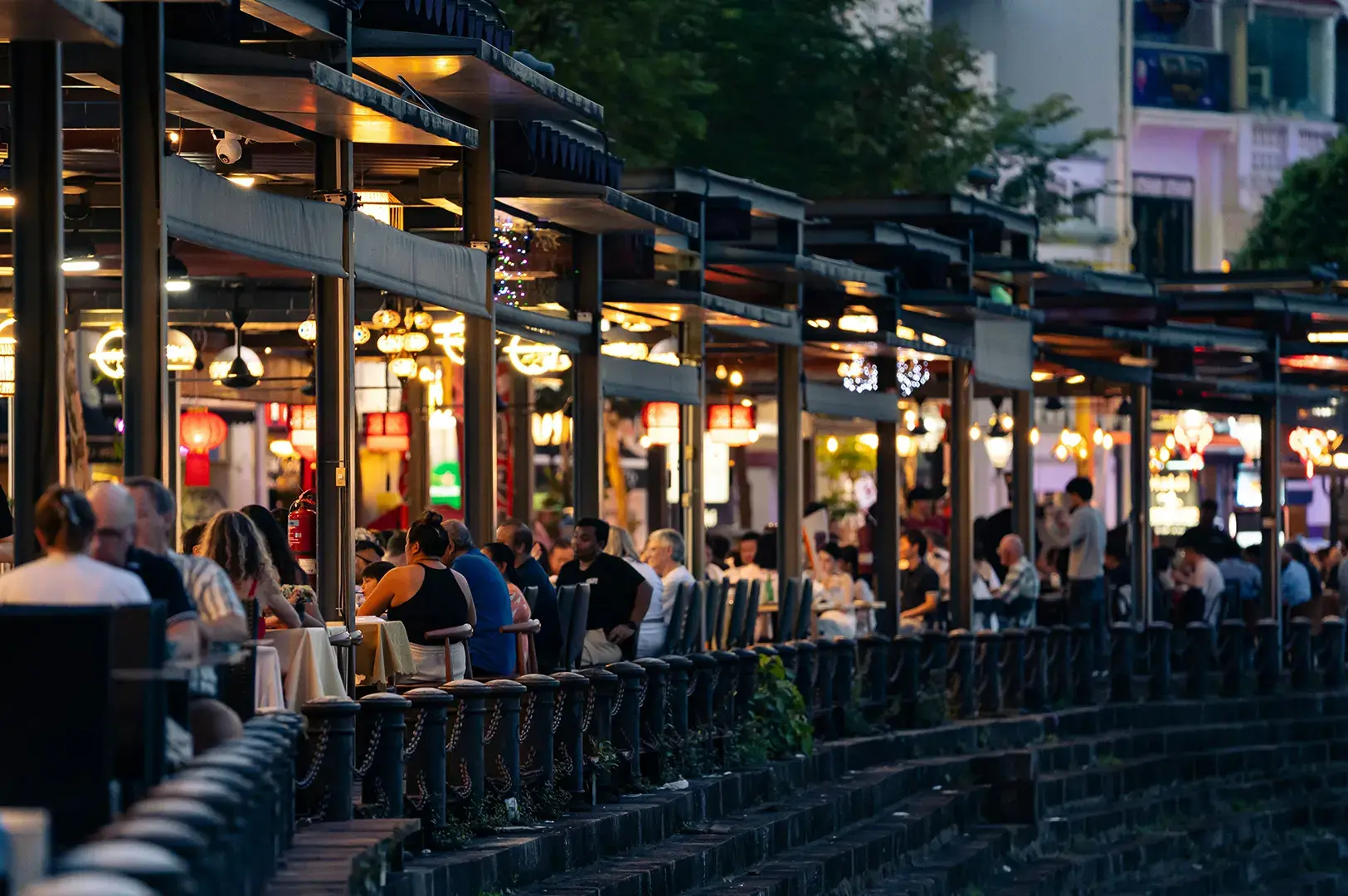 Outdoor dining at Singapore street market, evening.