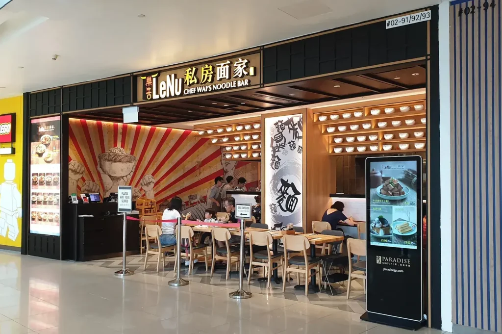 LeNu Chef Wai's Noodle Bar storefront with tables and diners.
